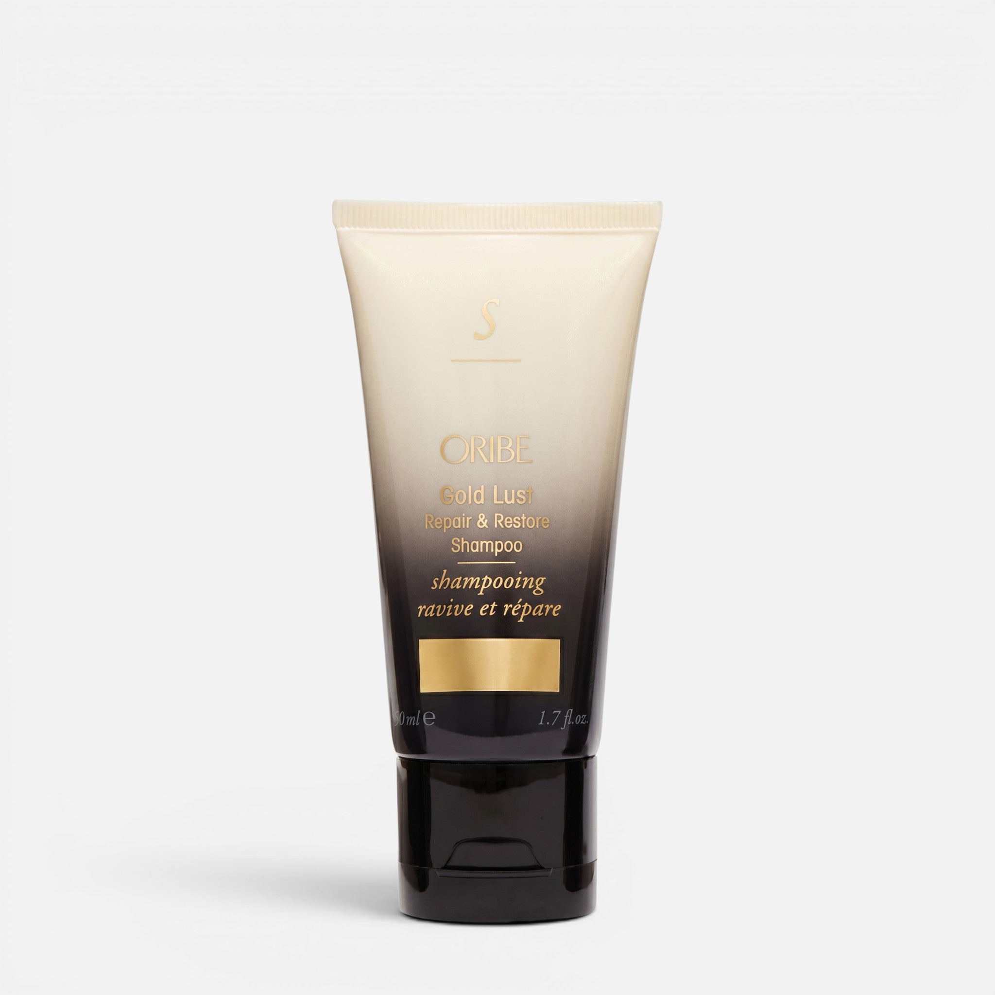 Shop Rescue Spa Oribe Gold Lust Repair & Restore Shampoo in a sleek black and cream travel-sized squeeze tube.