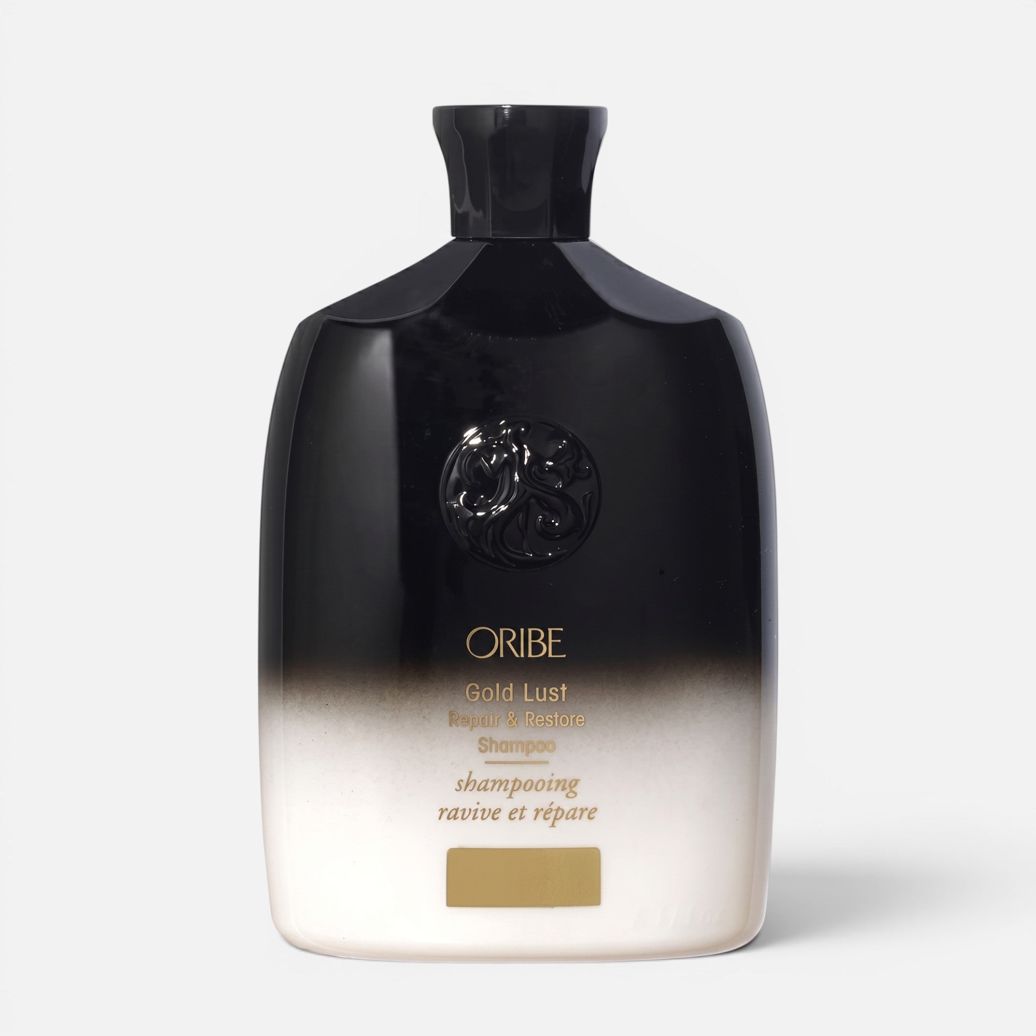 Shop Rescue Spa Oribe Gold Lust Repair & Restore Shampoo in a black and white ombre bottle with gold lettering.