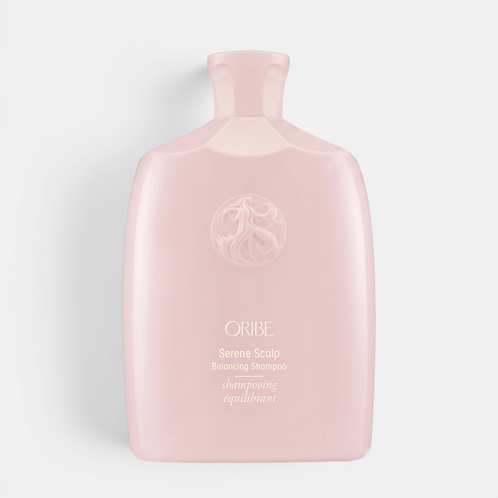 Shop Rescue Spa Oribe Serene Scalp anti-dandruff shampoo in a pale pink bottle with embossed logo