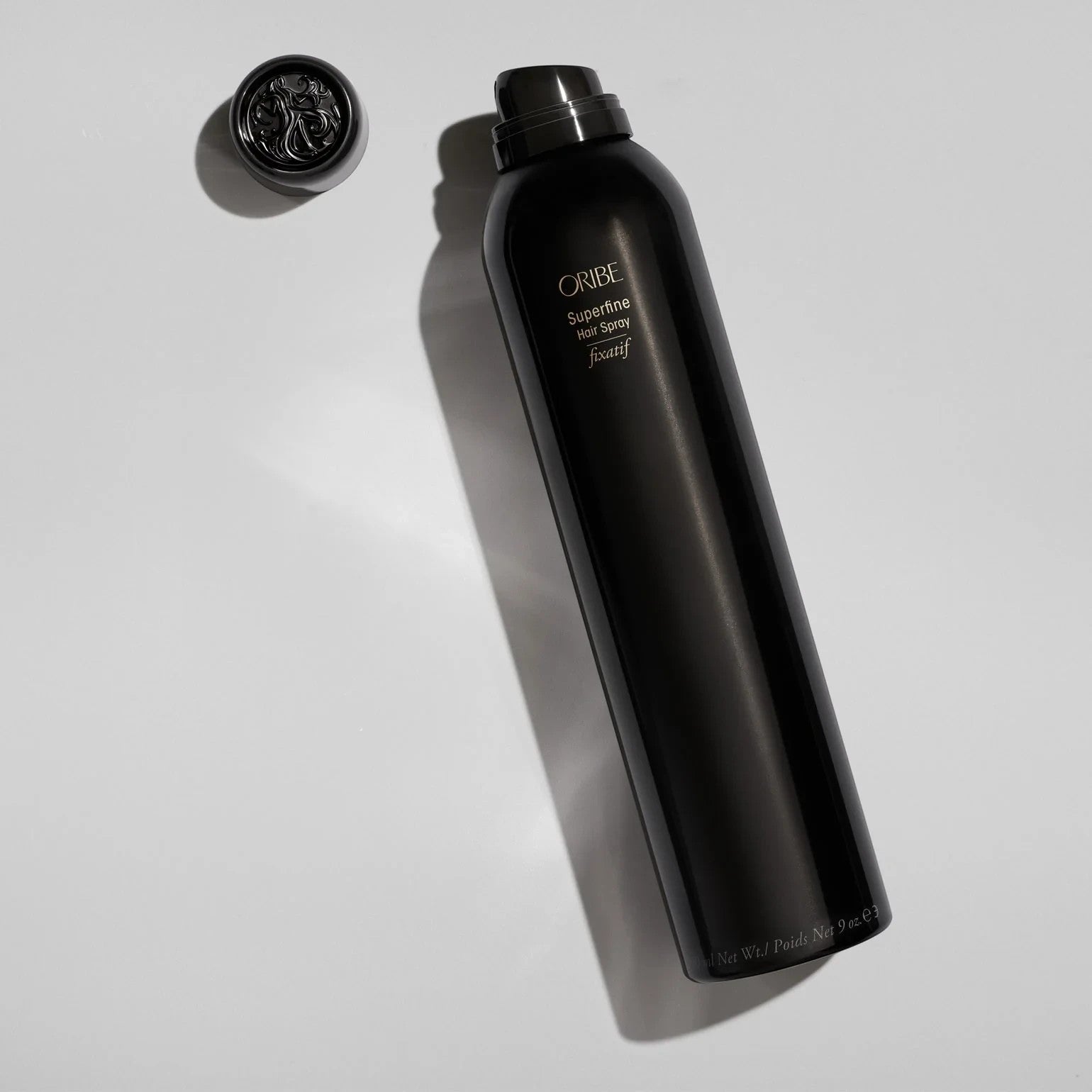 Shop Rescue Spa Oribe Superfine Hair Spray in a sleek black 9 oz aerosol bottle with a matching cap on white background