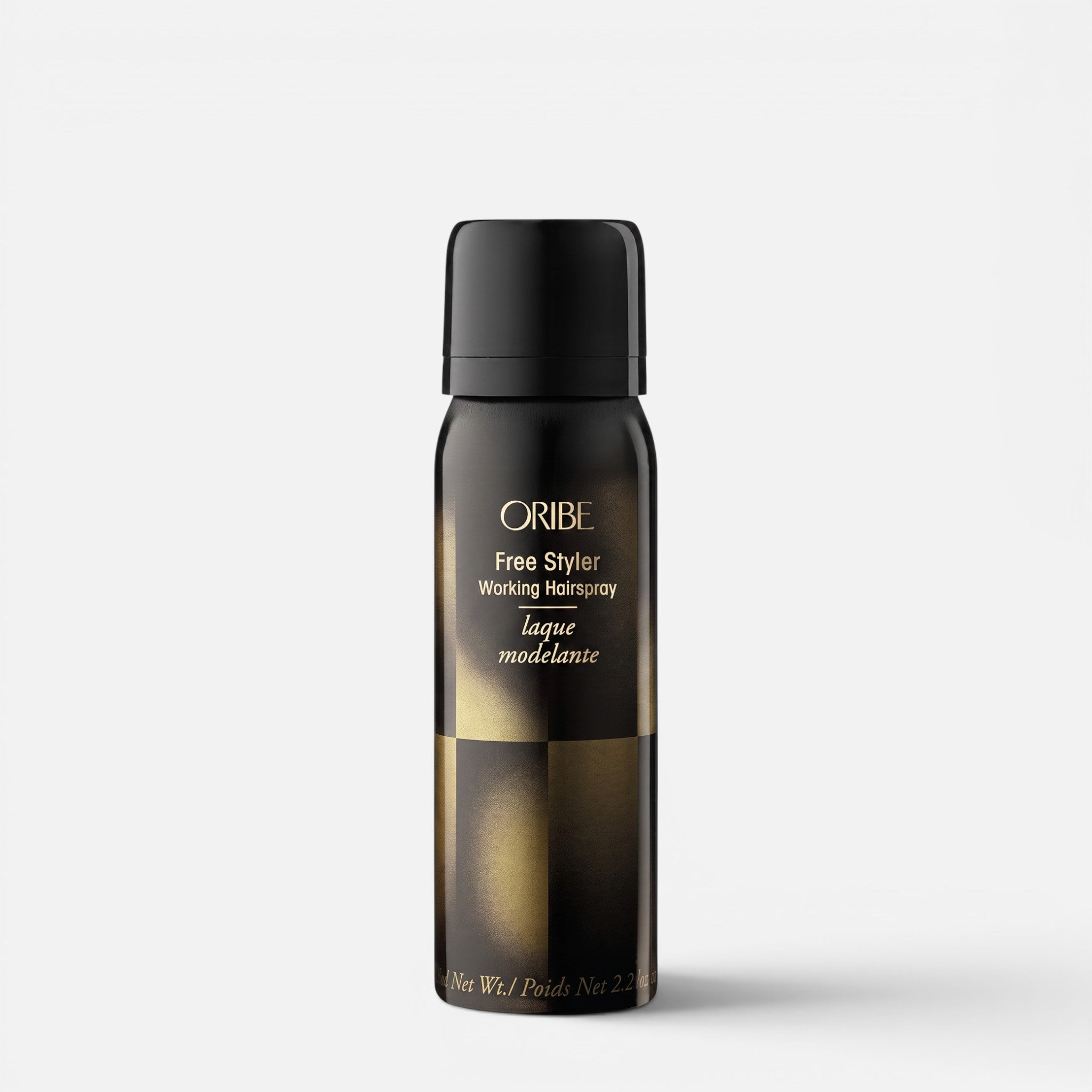Shop Rescue Spa Oribe Free Styler Working Hair Spray in a black and gold travel-size aerosol bottle.