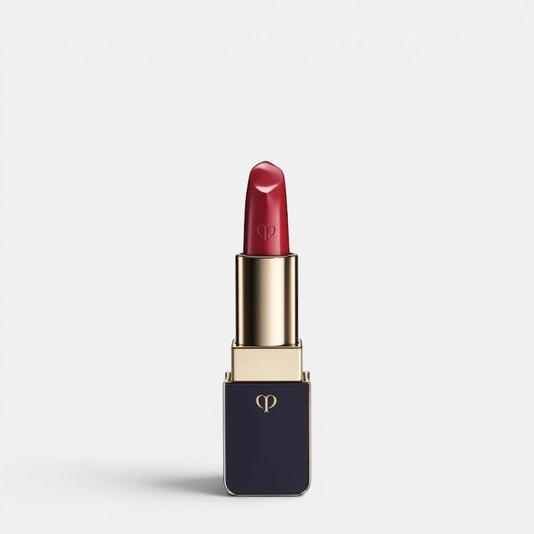 Shop Rescue Spa luxurious satin lipstick in a deep red shade with a gold and navy case.