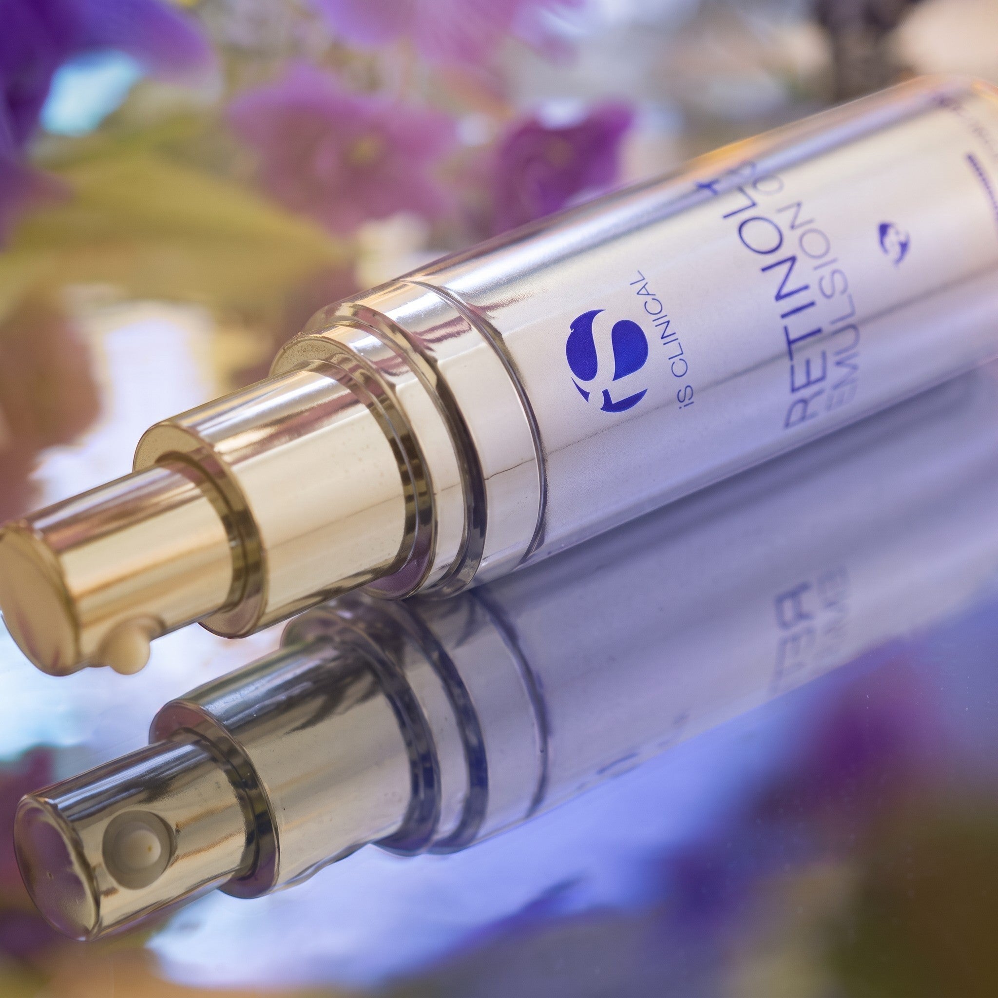 Shop Rescue Spa iS Clinical Retinol+ Emulsion 0.3 cream in a silver pump bottle with a drop of product visible.