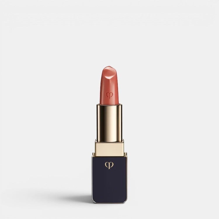 Shop Rescue Spa luxurious satin lipstick in a warm peachy-nude shade with a lustrous finish and gold accents.
