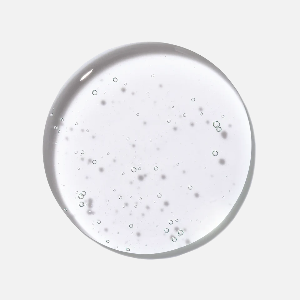 Shop Rescue Spa The Shampoo clear liquid texture with small bubbles, fragrance-free and vegan hair care formula.