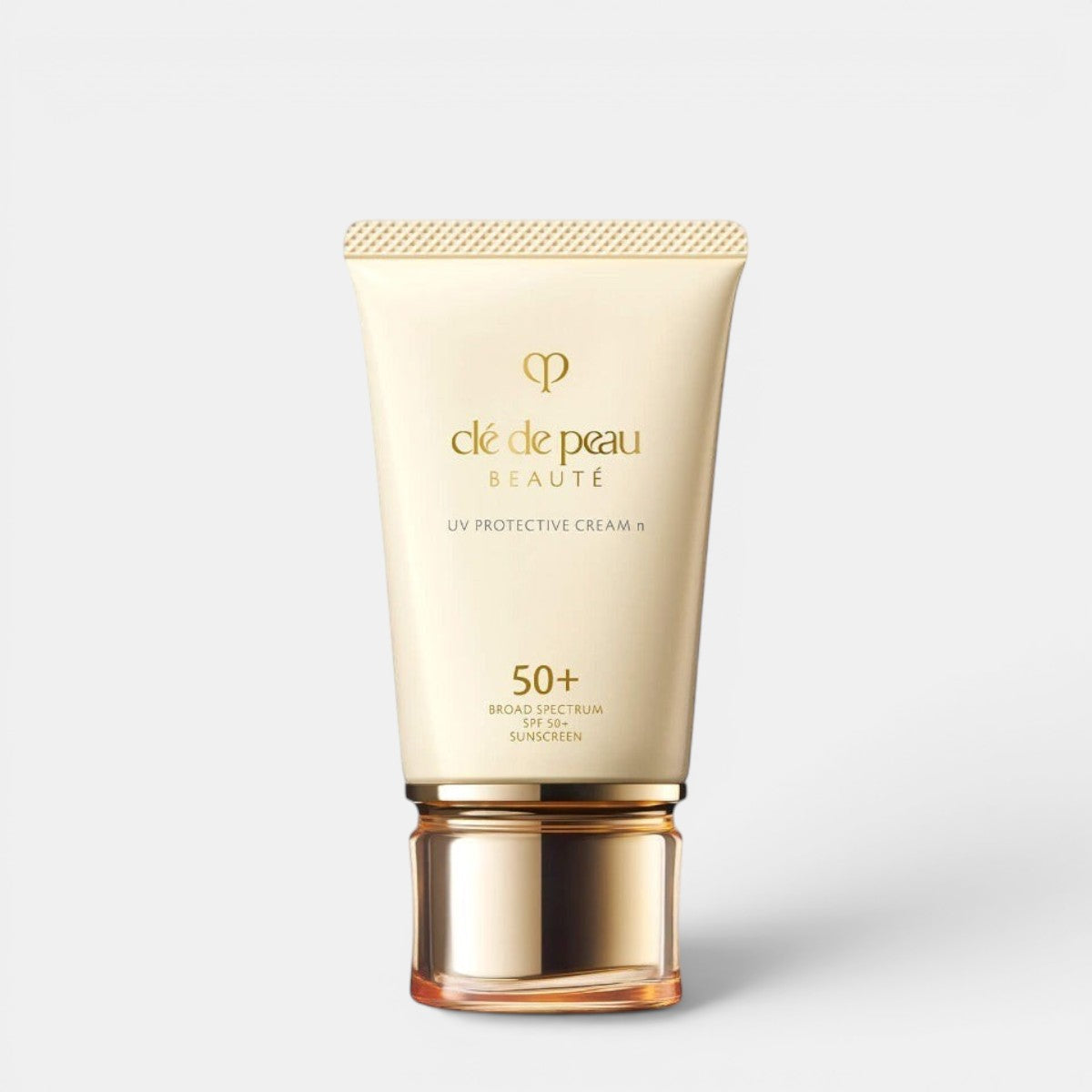 Shop Rescue Spa UV Protective Cream SPF 50+ broad spectrum sunscreen in a cream tube with gold cap.