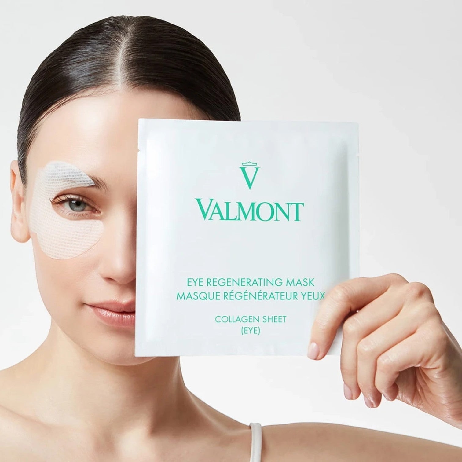 Shop Rescue Spa Valmont Eye Regenerating Mask collagen sheet on model to reduce puffiness and smooth fine lines