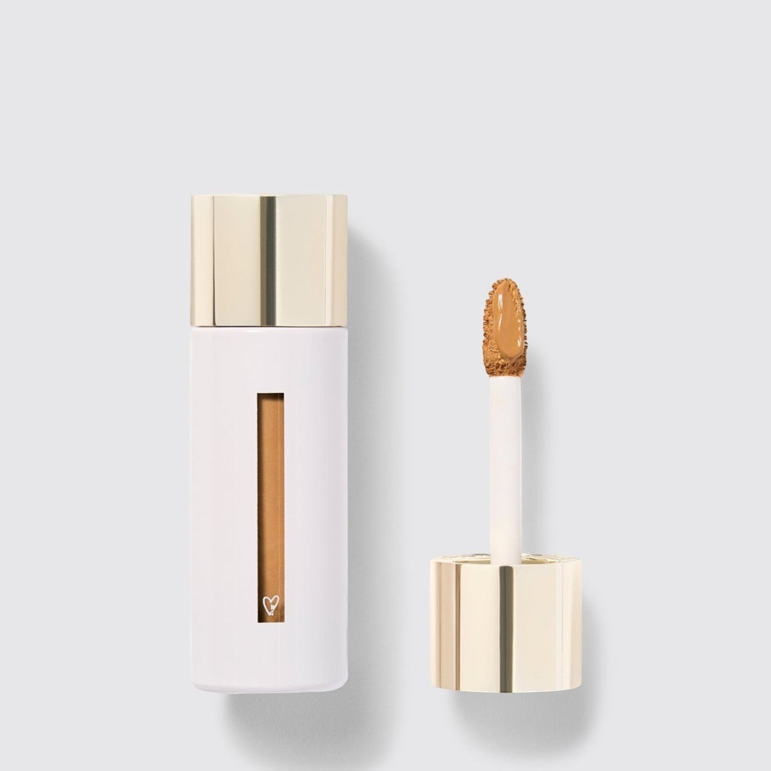Shop Rescue Spa Westman Atelier Vital Skincare Concealer with gold cap and doe-foot applicator on white background