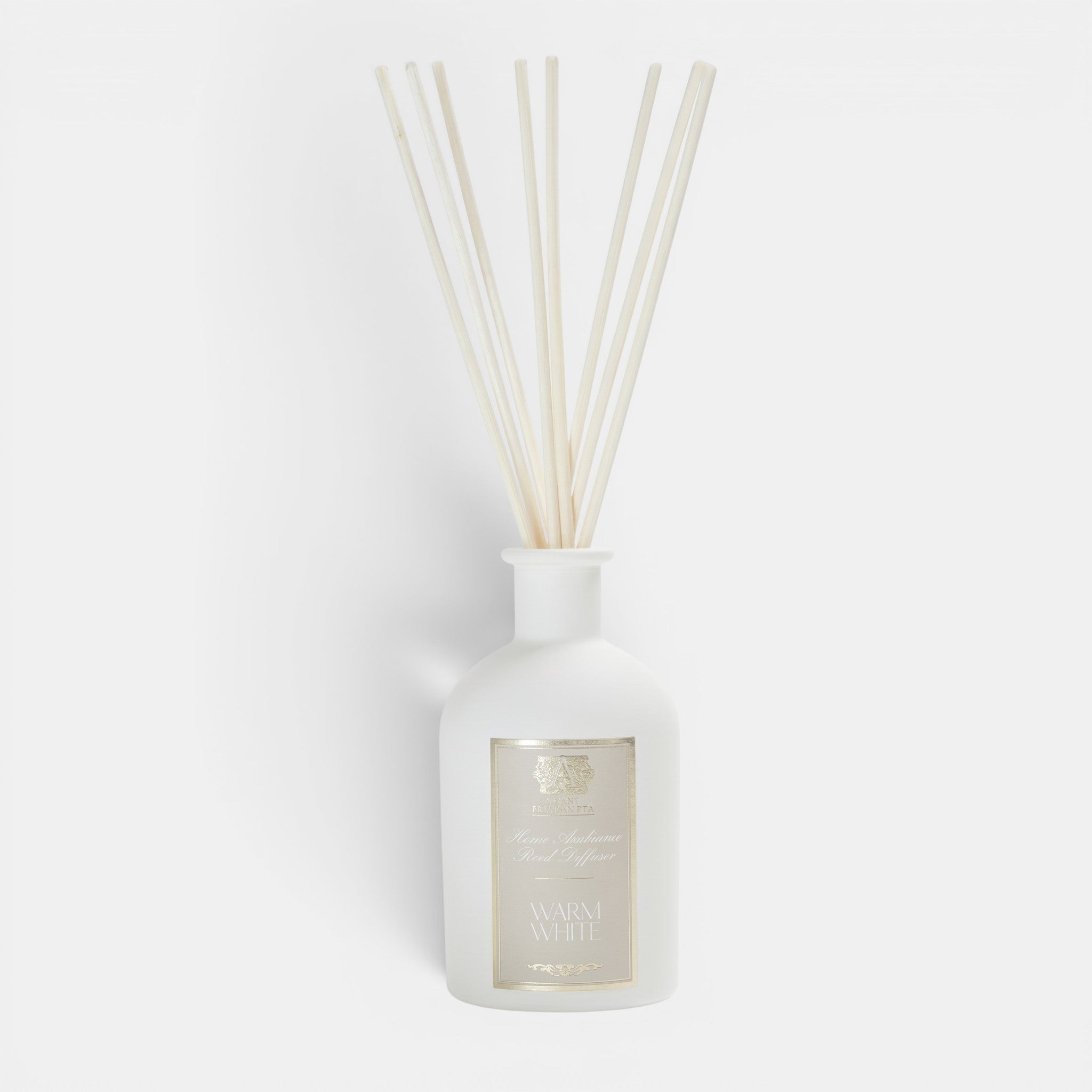 Shop Rescue Spa Antica Warm White reed diffuser in an elegant matte white apothecary bottle with natural reeds.