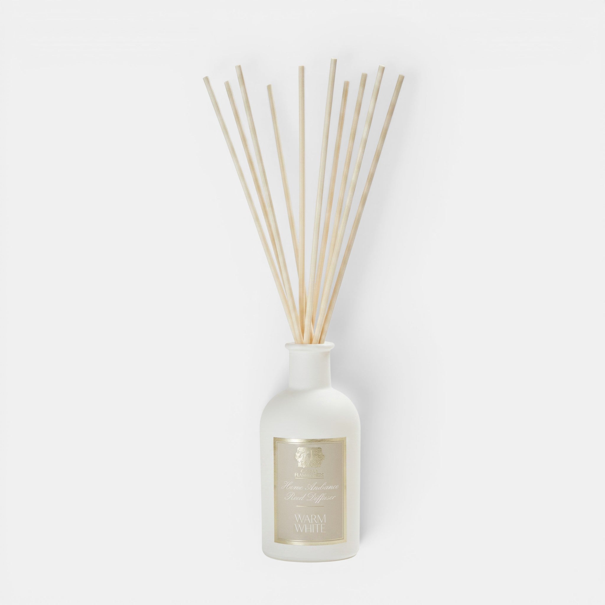 Shop Rescue Spa Warm White reed diffuser in a white apothecary-style glass bottle with natural wooden reeds.