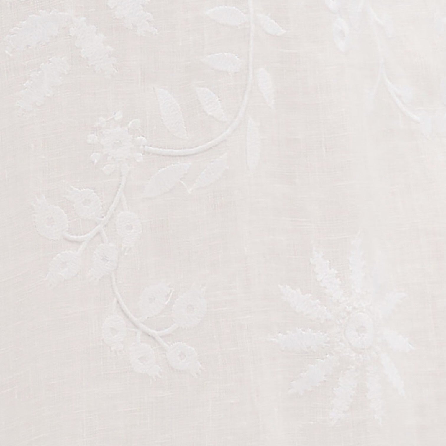 Shop Rescue Spa white linen fabric featuring delicate floral embroidery and artisanal hand-finished details.