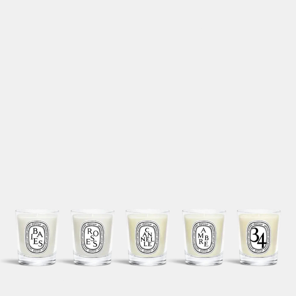 Shop Rescue Spa Diptyque holiday miniature candle gift set featuring five assorted scented candles in glass jars.