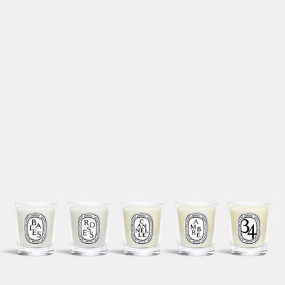 Shop Rescue Spa Diptyque holiday miniature candle gift set featuring five assorted scented candles in glass jars.