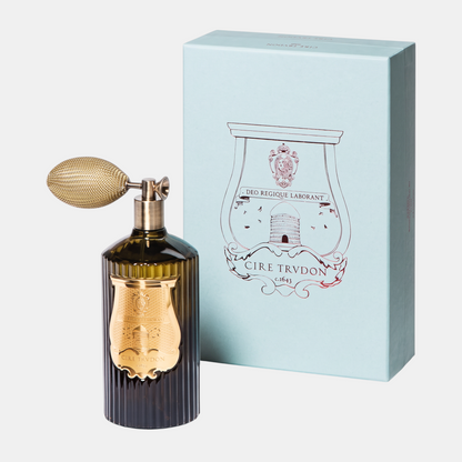 Shop Rescue Spa Ernesto room spray in a dark glass bottle with a gold atomizer bulb next to its light blue box.