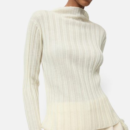 Shop Rescue Spa featherlight ribbed wool top in cream with a mock neck, worn by a model against a white background.