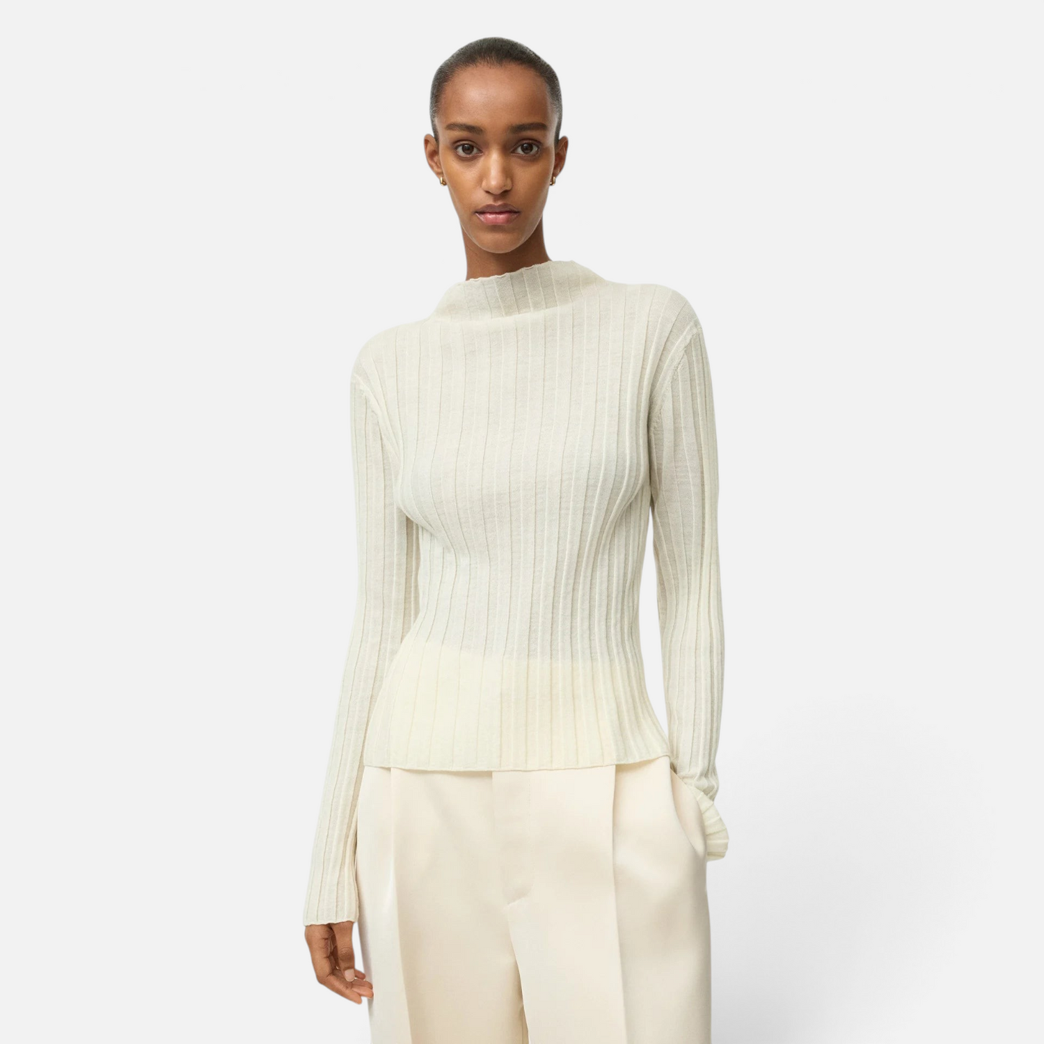 Shop Rescue Spa featherlight ribbed wool top in cream with a mock neck, worn by a model against a white background.