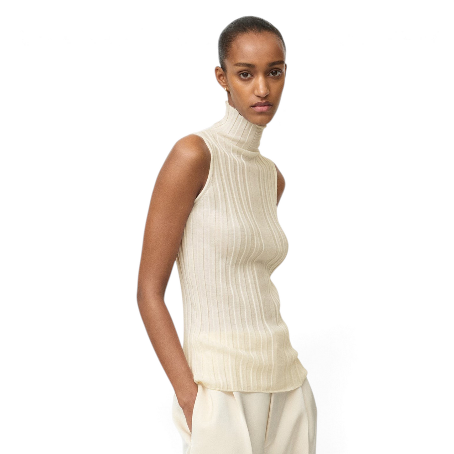 Shop Rescue Spa featherlight ribbed wool turtleneck singlet in cream worn by a model with wide-leg trousers