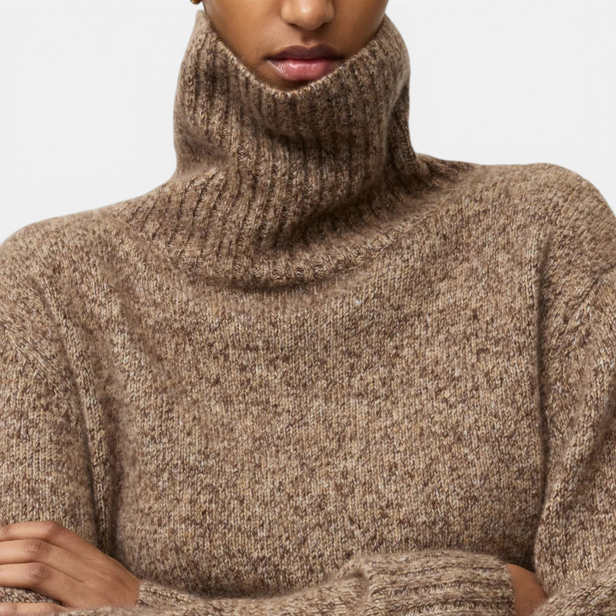 Shop Rescue Spa marled brown cashmere and silk turtleneck sweater with a relaxed fit on a model