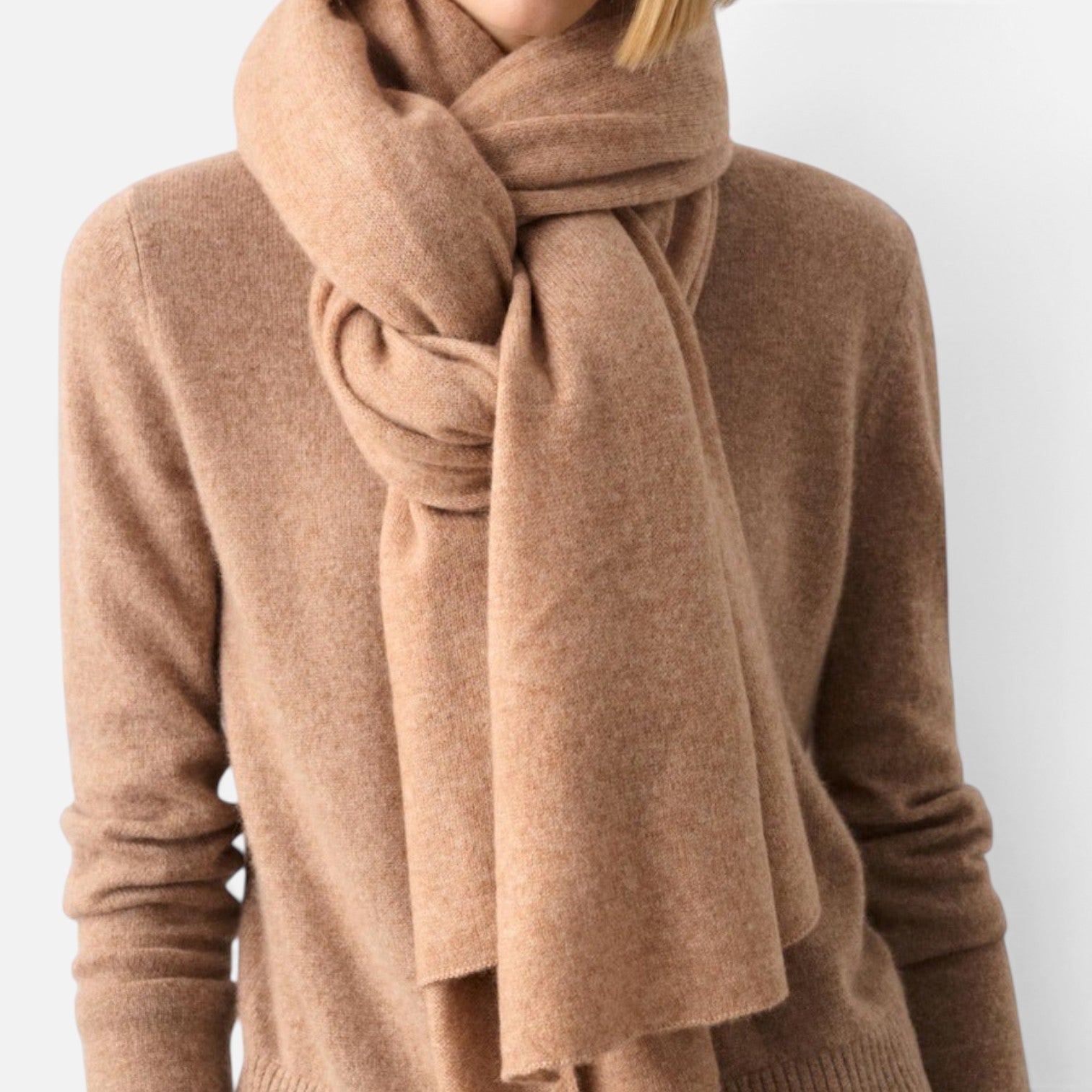Shop Rescue Spa cashmere travel wrap in a soft camel beige draped elegantly around a model&