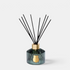 Shop Rescue Spa Trudon Figuerie home diffuser in a fluted green glass vessel with black reeds and gold emblem.