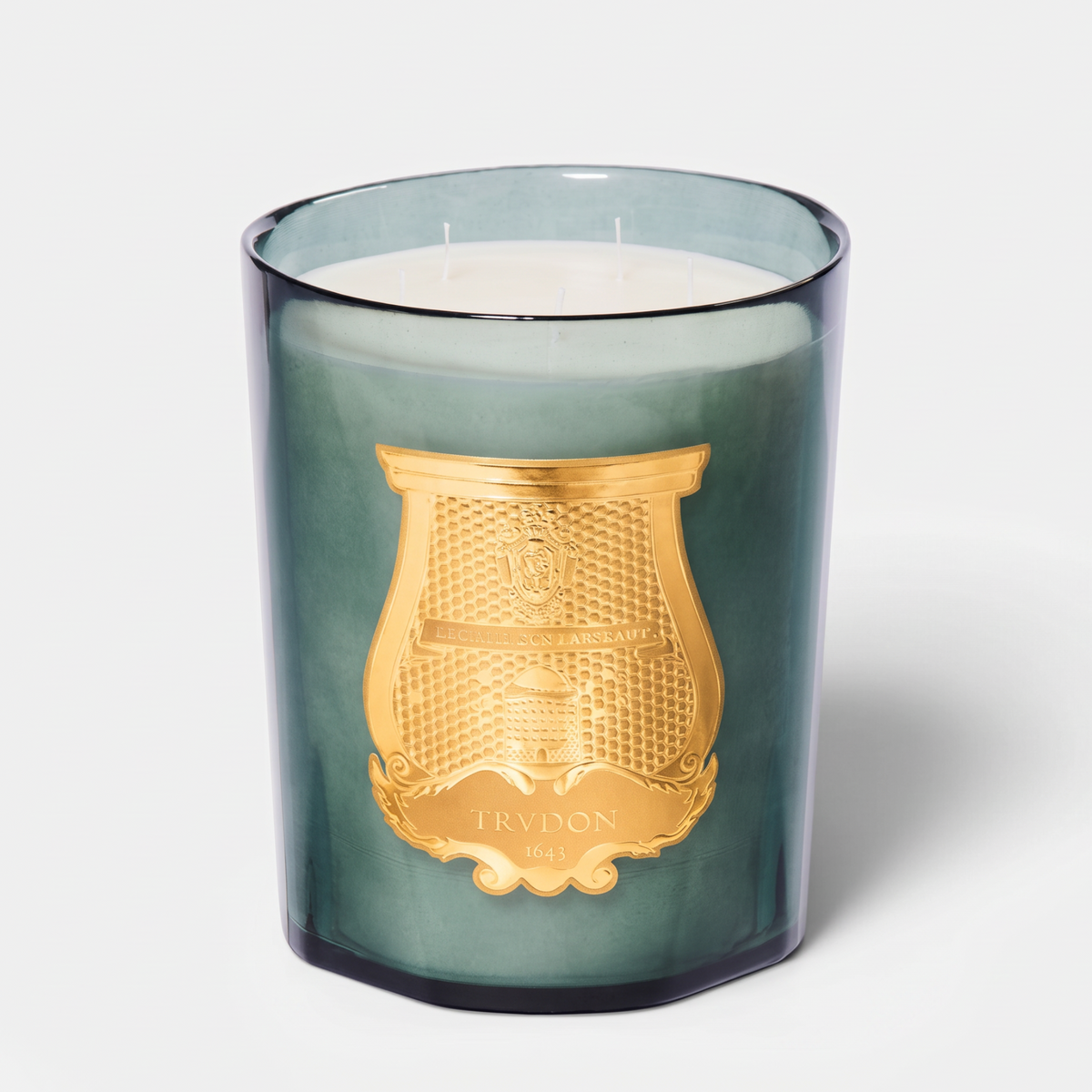 Shop Rescue Spa Figuerie candle in a green glass vessel with a gold emblem, featuring a multi-wick wax design.