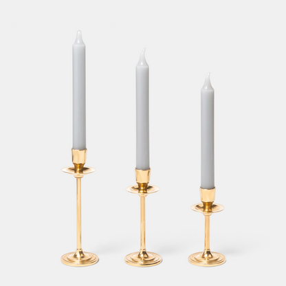 Shop Rescue Spa gold-plated candlestick trio in graduated heights with grey taper candles for elegant home decor