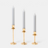 Shop Rescue Spa gold-plated candlestick trio in graduated heights with grey taper candles for elegant home decor
