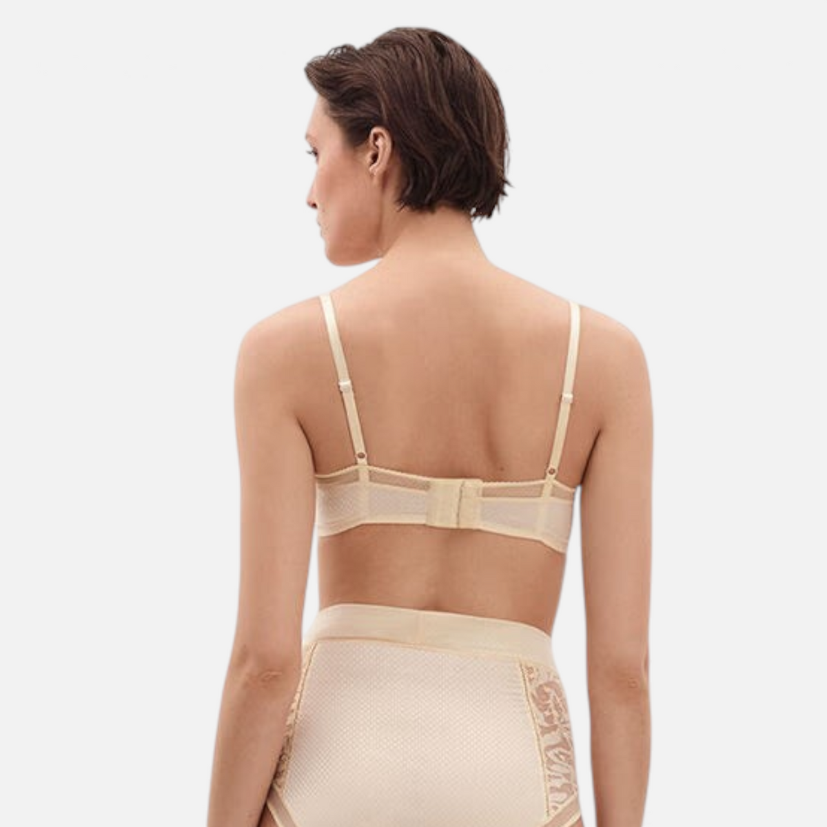 Shop Rescue Spa Pampille balconette bra and high-waisted briefs set in beige Leavers lace, back view on a model.