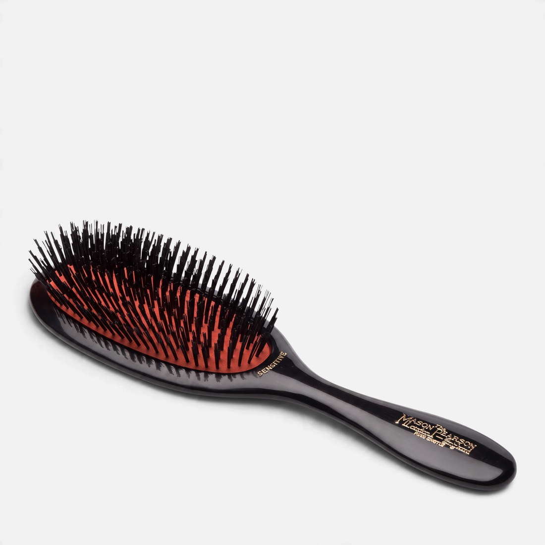 Shop Rescue Spa Mason Pearson Sensitive Bristle SB3 hairbrush with black handle and signature orange cushion pad.