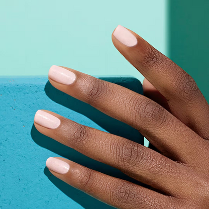 Shop Rescue Spa Manucurist Green Flash gel polish in a soft pastel pink shade on manicured nails with a glossy finish