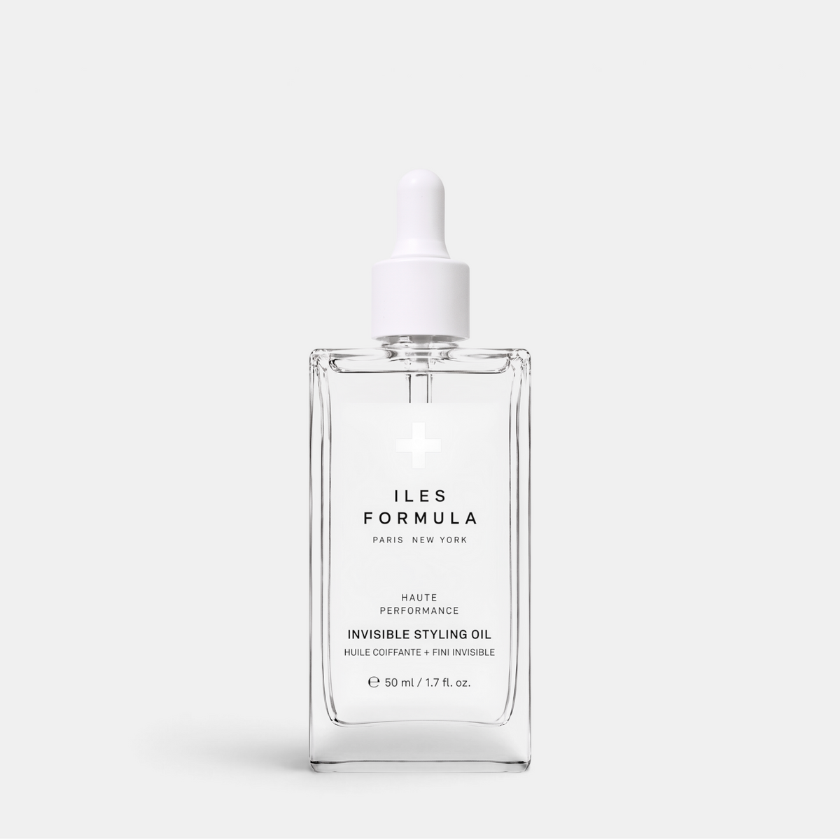 Shop Rescue Spa Iles Formula Invisible Styling Oil in a clear glass bottle with a white dropper cap