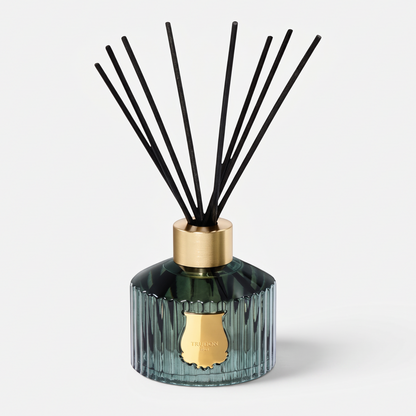 Shop Rescue Spa Trudon Figuerie Grand Diffuser in a ribbed green glass vessel with black reeds and gold emblem.