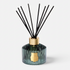 Shop Rescue Spa Trudon Figuerie Grand Diffuser in a ribbed green glass vessel with black reeds and gold emblem.