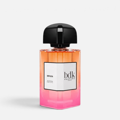 Shop Rescue Spa Impadia Eau de Parfum in a 100ml glass bottle with a gradient orange to pink design and black cap.