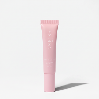 Shop Rescue Spa AN-GLOSS Ceramide Lip Tint in a soft pink squeeze tube with minimalist white branding.