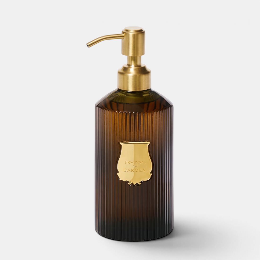 Shop Rescue Spa Trudon Carmen scented hand soap in a ribbed amber glass bottle with a gold pump dispenser