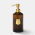Shop Rescue Spa Trudon Carmen scented hand soap in a ribbed amber glass bottle with a gold pump dispenser