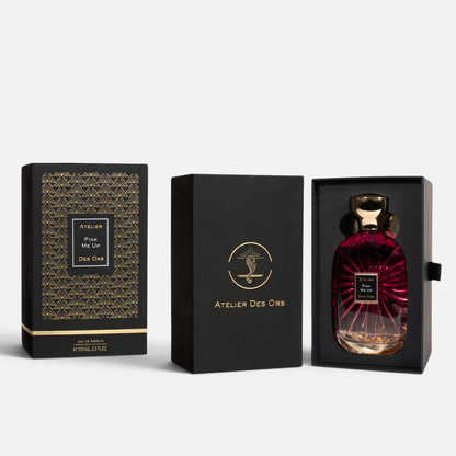 Shop Rescue Spa Pink Me Up perfume bottle in a black gift box with gold art deco patterns and gold flakes inside.