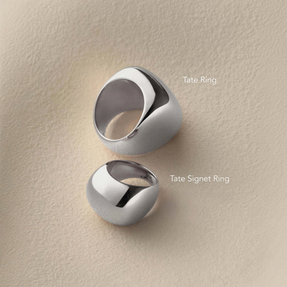 Shop Rescue Spa Tate Ring and Tate Signet Ring in high-polish platinum-plated steel with a rounded sculptural form.