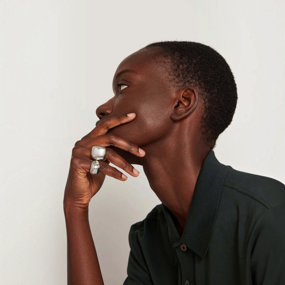 Shop Rescue Spa Tate Signet Ring in high-polish platinum-plated steel worn on a model&