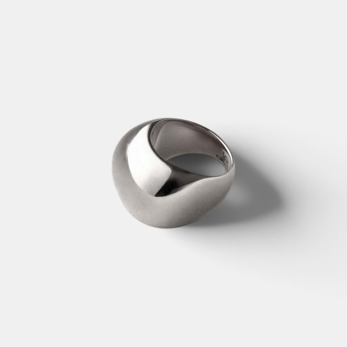 Shop Rescue Spa Tate signet ring in high-polish platinum plated steel with a rounded rectangular sculptural design.