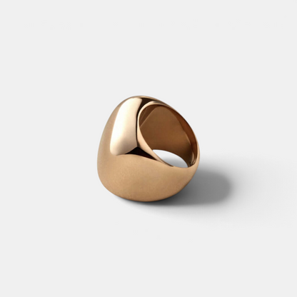 Shop Rescue Spa Tate Ring in high-polish gold with a bold, sculptural rounded rectangular silhouette.
