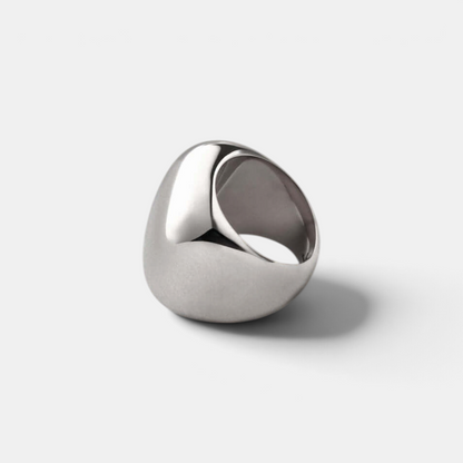 Shop Rescue Spa Tate Ring in high-polish platinum plated steel with a bold, rounded rectangular sculptural form.