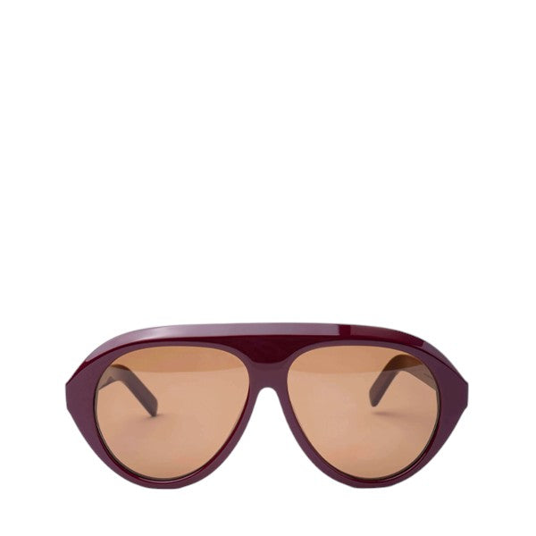 Product photo of Past Midnight The Icon Sunglasses in burgundy on a white background, positioned at the bottom of the frame with arms open, showing full frame shape.