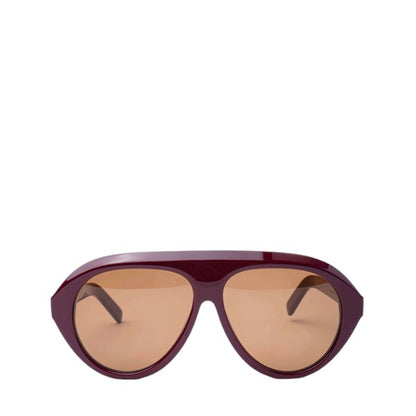 Product photo of Past Midnight The Icon Sunglasses in burgundy on a white background, positioned at the bottom of the frame with arms open, showing full frame shape.