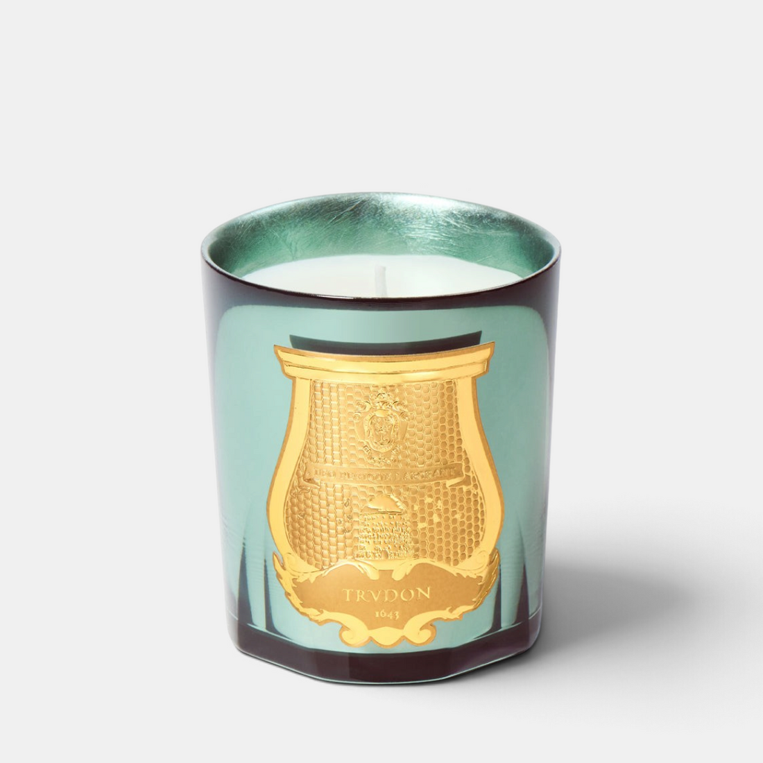 Shop Rescue Spa Trudon Fir candle in a celadon lacquered glass with silver leaf interior and gold emblem