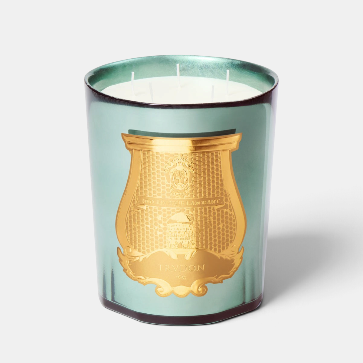 Shop Rescue Spa Trudon Fir holiday candle in a celadon mirror-finish glass with a gold emblem and three wicks.