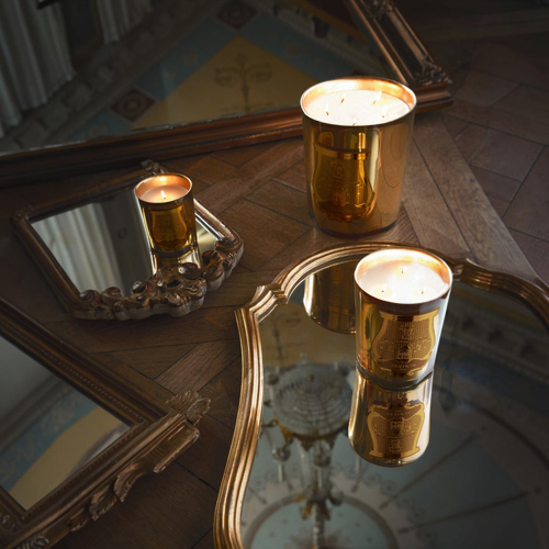 Shop Rescue Spa Galerie des flammes candles in gold mirror-finish glass on a wooden table with ornate mirrors