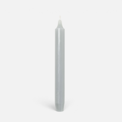 Shop Rescue Spa Madeleine taper candle in a smooth grey wax finish, standing vertically against a plain background.