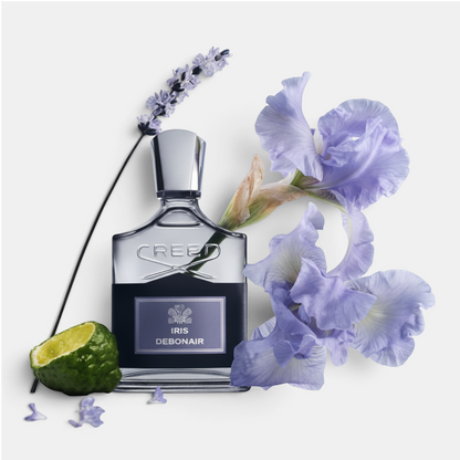 Shop Rescue Spa Iris Debonair eau de parfum bottle surrounded by fresh lavender, iris flowers, and a halved bergamot.